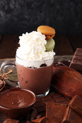 Hot chocolate or coffee with whipped cream in glass