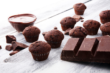 Chocolate muffins, homemade bakery on white wooden background