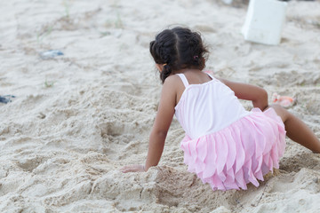 Asian girl playing on the beach