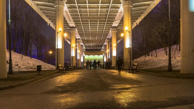 pedestrian motion under high overpass  to entrance of subway, time lapse