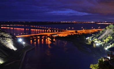 Fototapeta na wymiar Montmorency waterfalls - illuminated bay and river from top of the waterfalls at night - Quebec - Canada