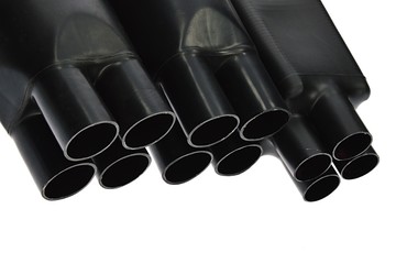 Fototapeta premium Funnel looking black rubber shrinkable cable breakout boots of various diameters, white background