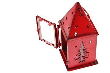 Red christmas lantern made of plate steel with holes shaped like tree and stars, opened doors, white background. 