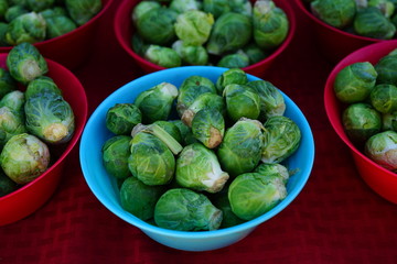 Baskets of fresh organic green Brussels sprouts