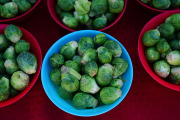Baskets of fresh organic green Brussels sprouts