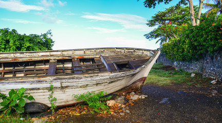 An old wooden boat lying on beach