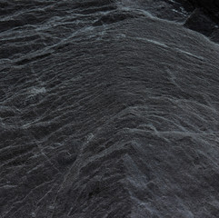 Dark grey black slate background or texture.