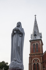 statue of mary and church