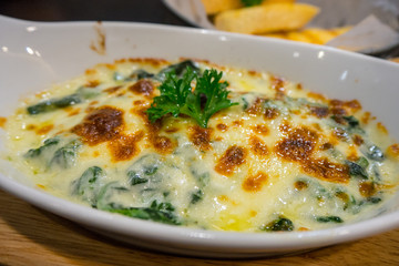 Close up spinach lasagna in white plate - Italian food style