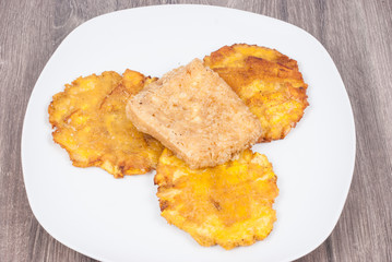 Fried plantain toston (patacon) with fried cheese