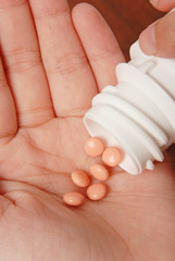 Medicine pills on the palm