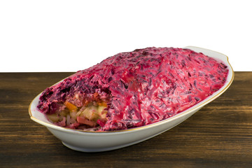 Russian traditional multicomponent salad with boiled vegetables and herring.