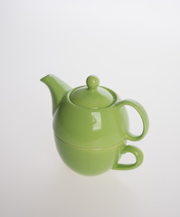 Tea pot set or Porcelain tea pot and cup on background.