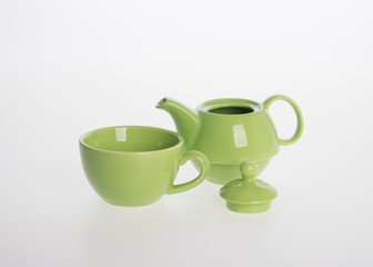 Tea pot set or Porcelain tea pot and cup on background.