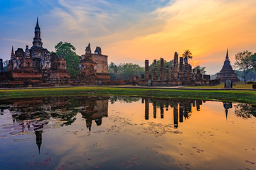 Fototapeta na wymiar Ruins of the temple of Wat Mahathat Temple in the precinct of Sukhothai Historical Park, a UNESCO World Heritage Site, Evening in the historical park of Sukhothai city. Thailand