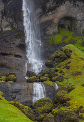waterfall with rocks and green moss