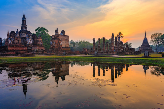 Ruins of the temple of Wat Mahathat Temple in the precinct of Sukhothai Historical Park, a UNESCO World Heritage Site, Evening in the historical park of Sukhothai city. Thailand