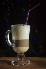 Coffee with milk in a transparent cup