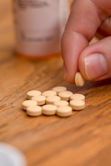 Woman holding a pill