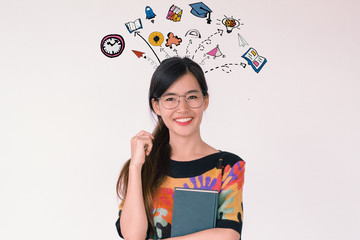 Back to school and education concept: A portrait of young asian student smiling with education and learnining doodles icon.