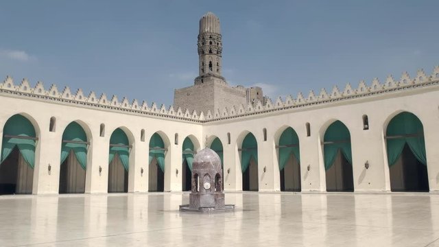 panning shot of the courtyard of the al-hakim mosque in cairo, egypt