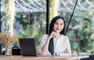 Modern business woman working in the office with copy space