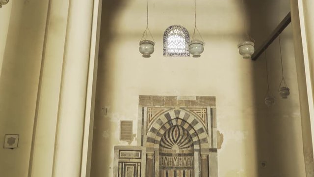 tilt up shot of the mihrab in al hakim mosque in cairo, egypt