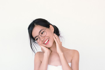 Beauty Skincare concept-  Head Shot portrait of Young Asian woman wearing glasses smiling and laughing