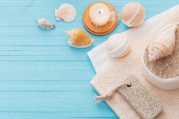 Spa concept with candles on blue wooden background