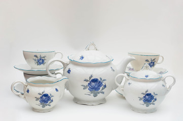 Old faience tea or coffee server set with blue rose pattern