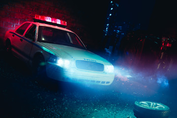 Fototapeta na wymiar Police car arriving near a car crash / scale model scene