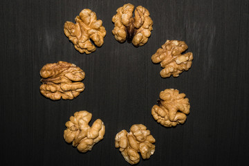walnuts on black background. Top view with copy space for your text