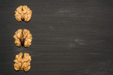 walnuts on black background. Top view with copy space for your text