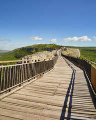 Fototapeta premium Wooden bridge and Gate of ancient fortress. Ovech Fortress, Provadia, Bulgaria
