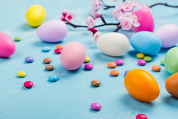 Colorful decorative eggs on spring background