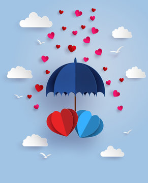 twin heart under blue umbrella floating on the sky with cloud