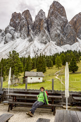 Fototapeta na wymiar Woman hiking in the nature park Geisler-Puez in South Tyrol