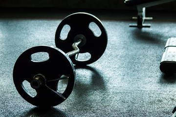Naklejka na ściany i meble Weight on floor at fitness gym. Selective focus.