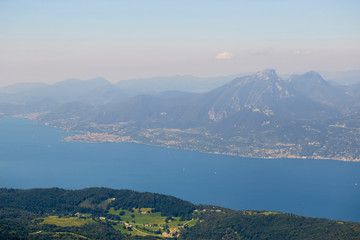 Lago di Garda lake from mountain Monte Baldo in Italy. Beautiful summer landscape. Travel in Europe.