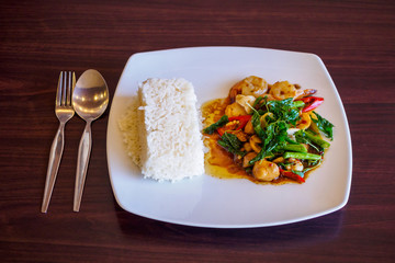 Rice with stir-fried seafood and basil
