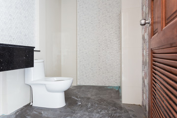 Naklejka na ściany i meble Modern design home bathroom White sanitary ware in the bathroom. Under construction