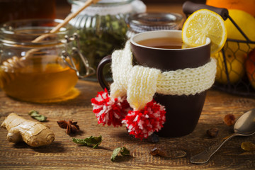 Cup with scarf with hot tea.