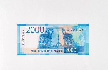 paper money bills of the new Russian rubles Olympic jubilee on white background isolate