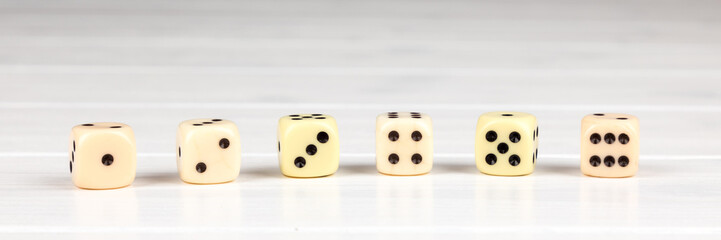 cube one to six on wooden background