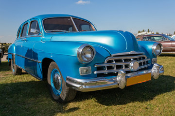 Vintage car staying at sunset.