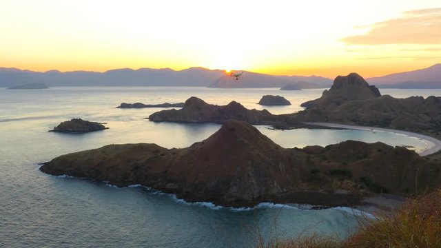 Drone pilot with high resolution camera flying over padar island in Komodo, Indonesia.