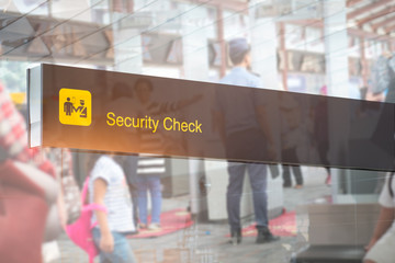 Double exposure of security check airport sign ,Airport security check at gates with metal detector...