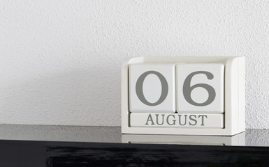 White block calendar present date 6 and month August