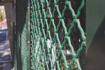 Metal gate protecting a store. Close shop.