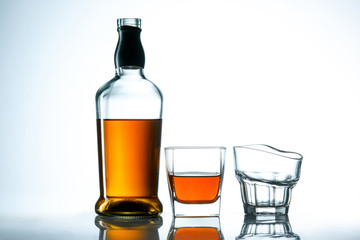Naklejka na ściany i meble The curved glass of whiskey or alcohol drink
